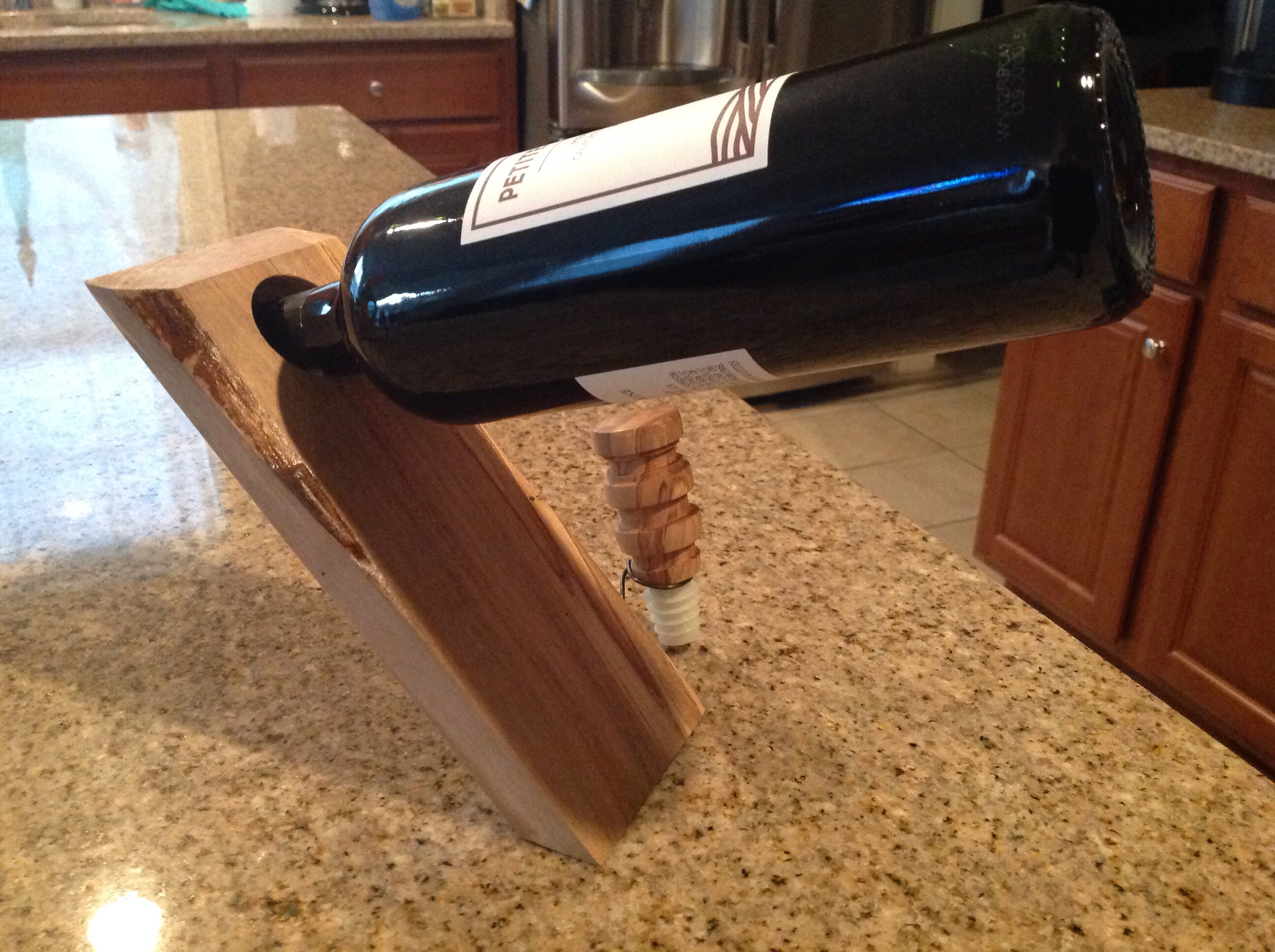 Floating wine bottle holder